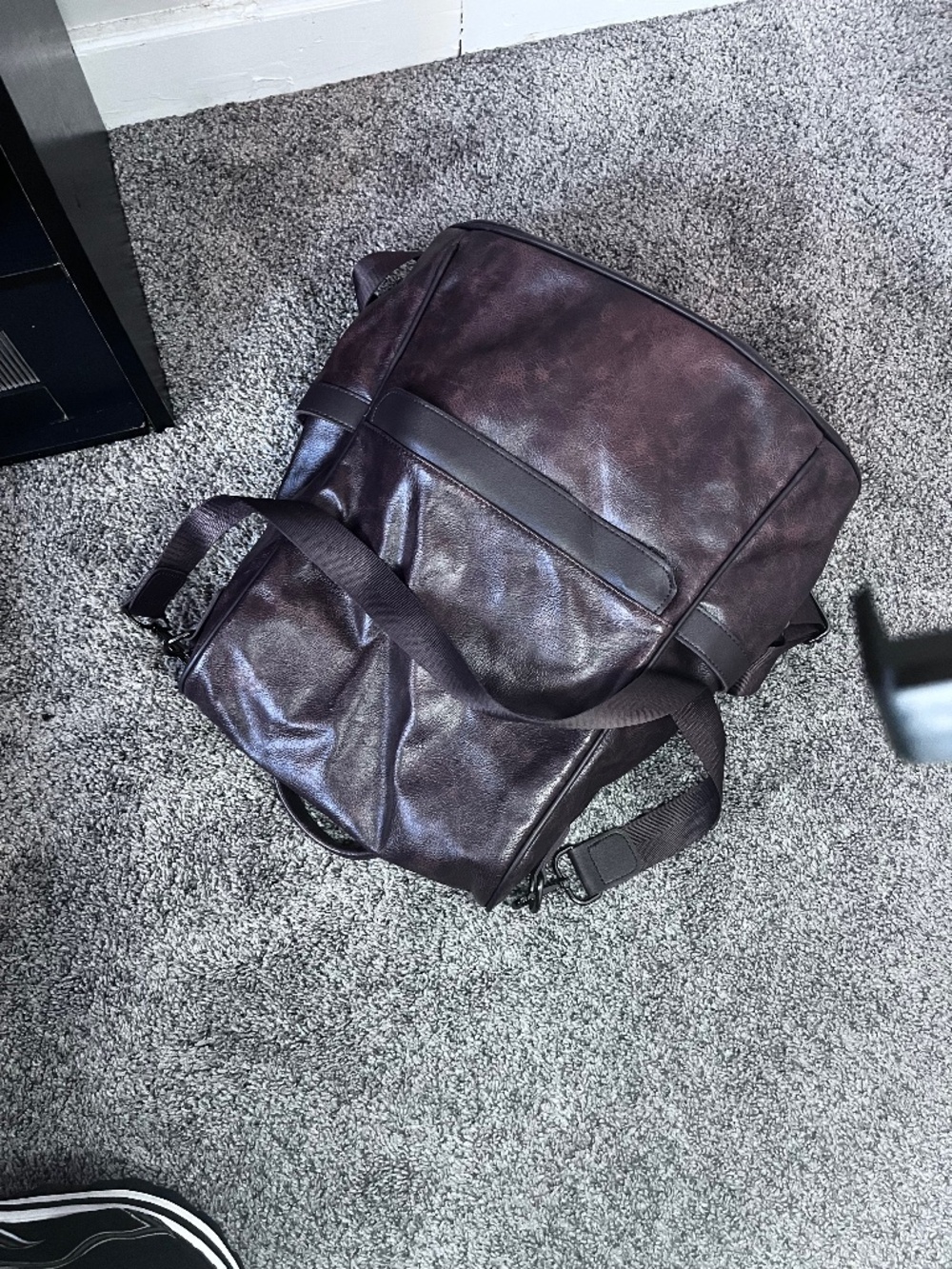 CHERUTI dark brown leather travel backpack featuring an interior fabric lining